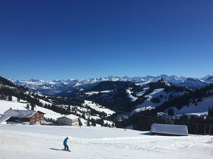 a person is skiing down a snowy hill