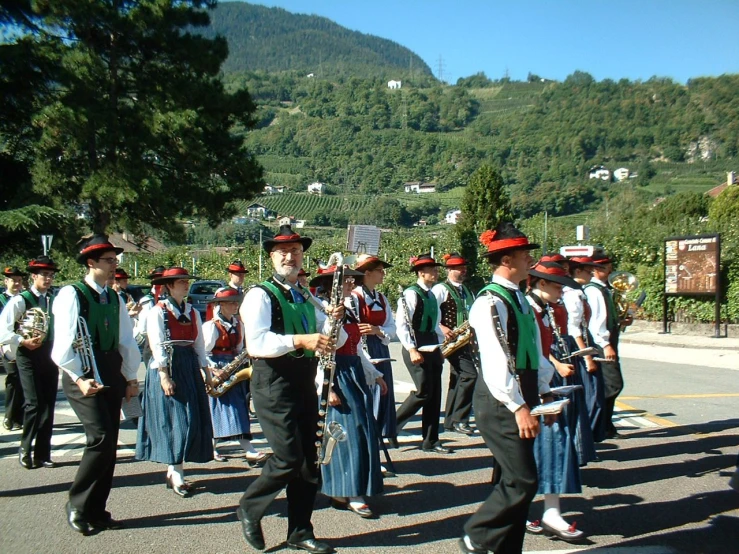 a band marching down the road in the country side