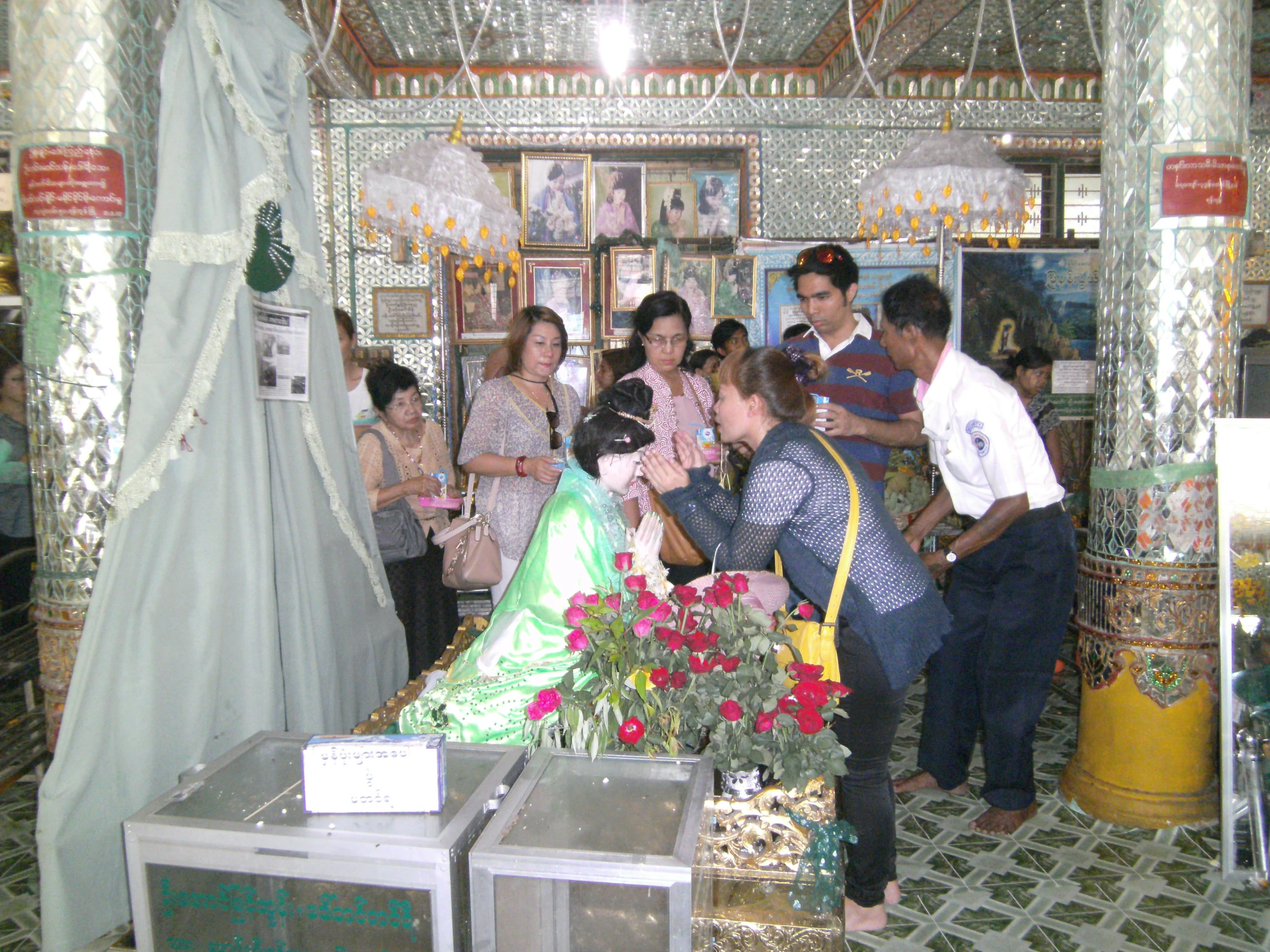 people gather around and talk at a wedding ceremony