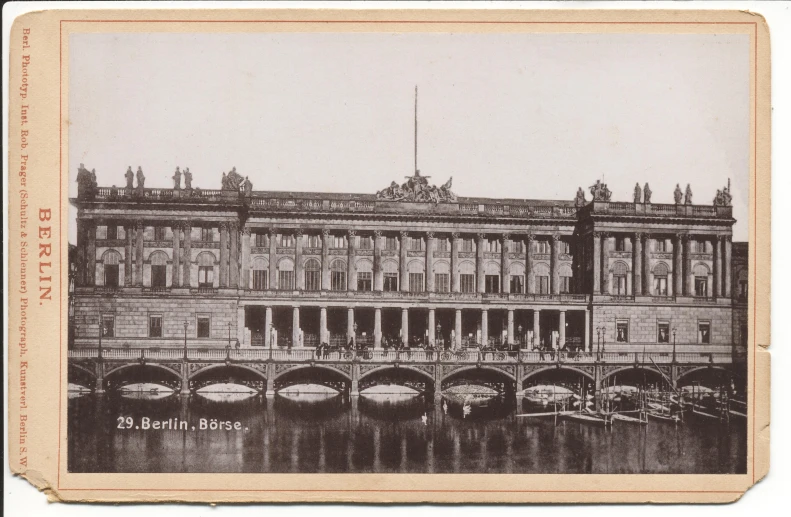 old pograph of the building across from the river