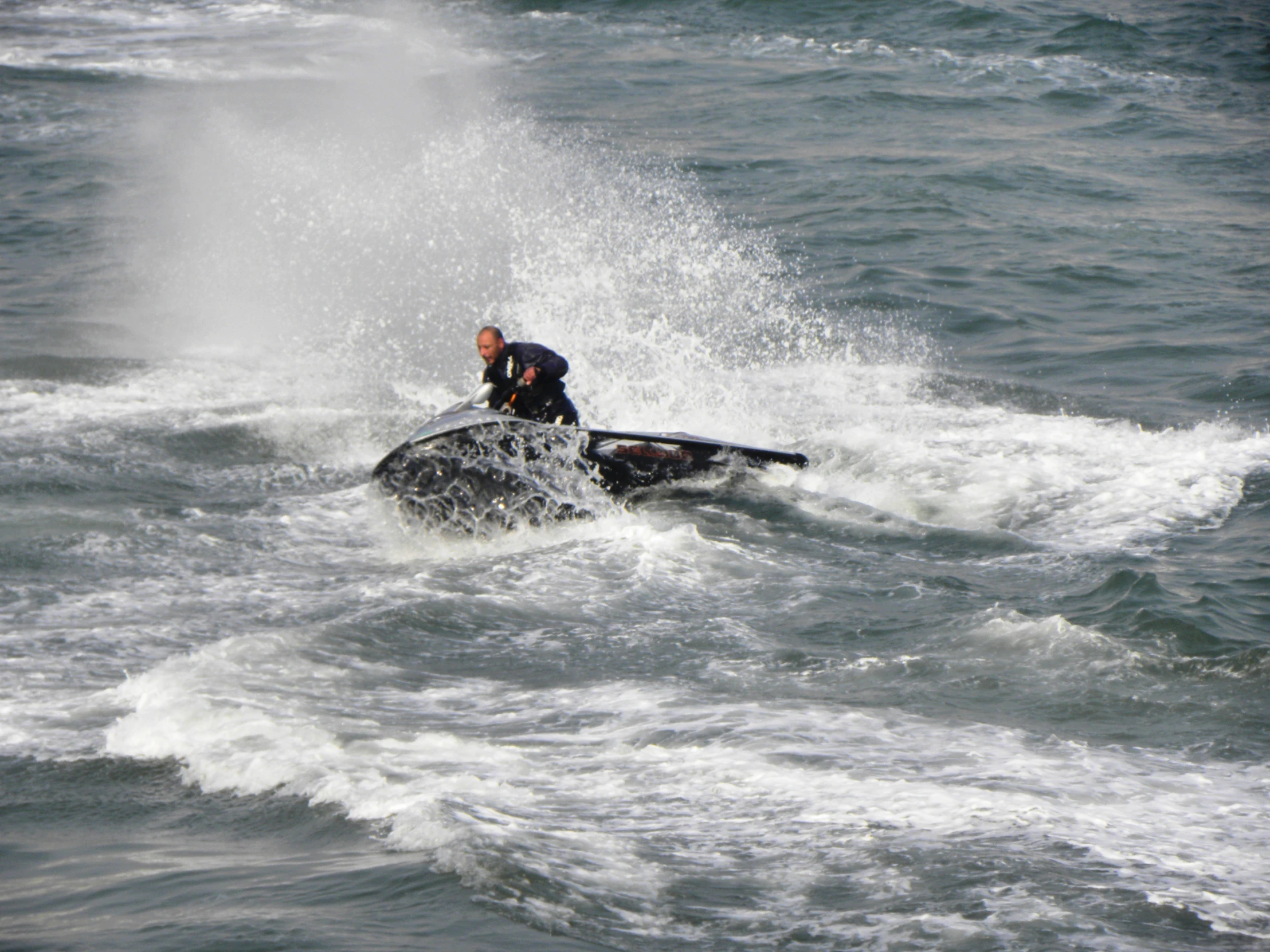 a man is jet skiing in the water