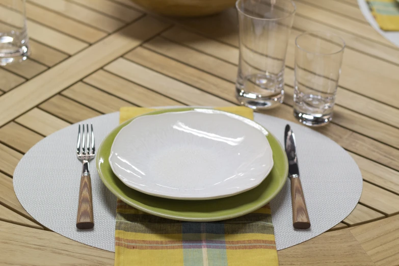 a table with several plates and glasses on top of it