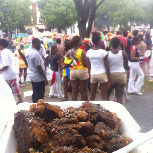 a big box full of food sitting in the middle of a street