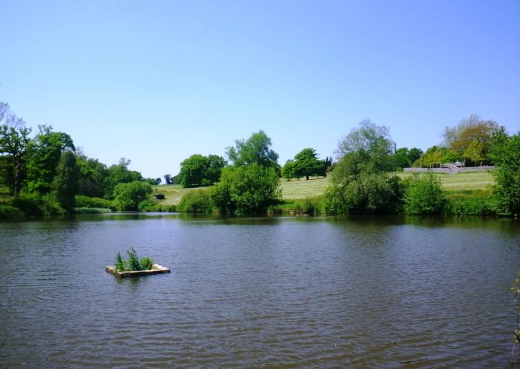 there is an empty boat in the middle of the water