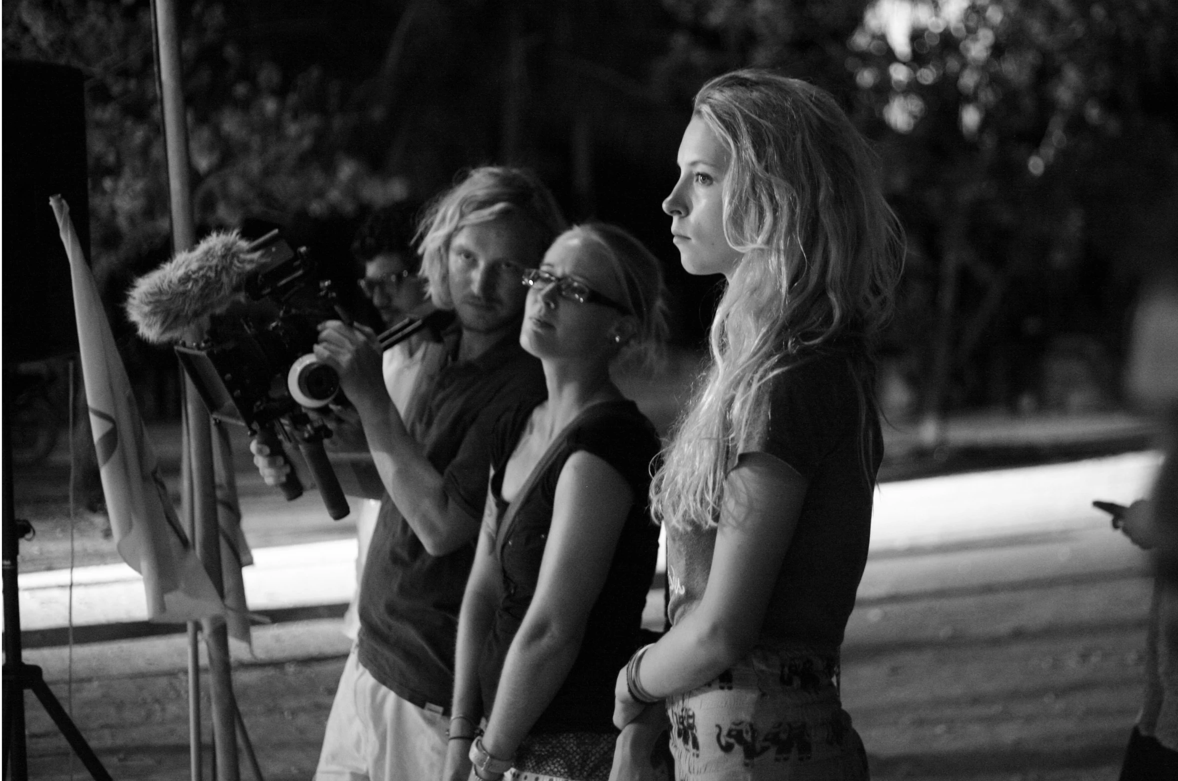 black and white po of women with camera equipment