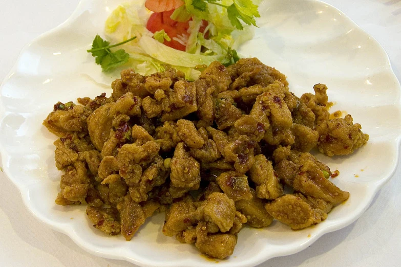 a white plate with some kind of food