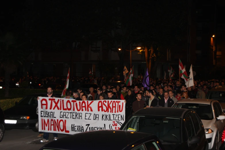 a large crowd gathered in the city at night