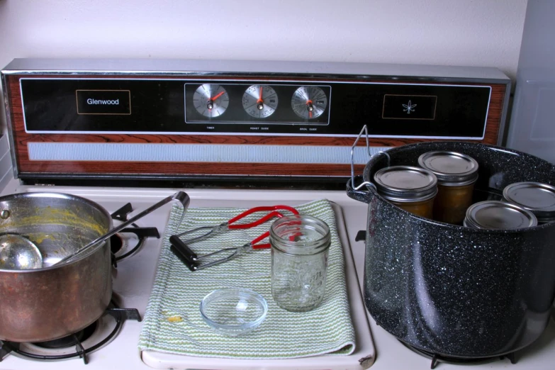 the pots and pans are next to the electric stove