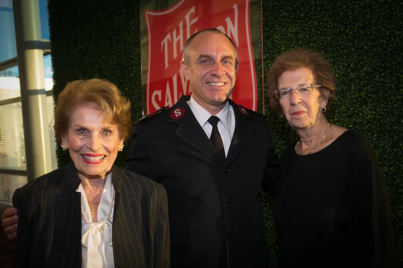 two men and an old woman posing for a picture