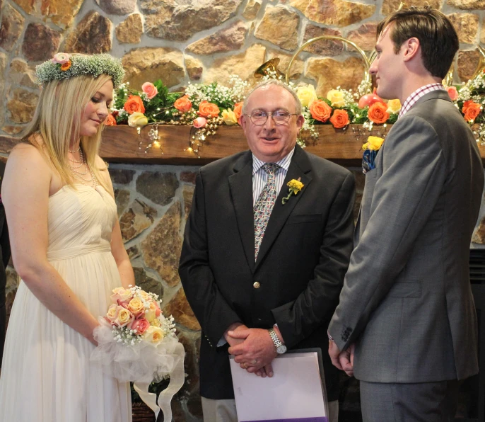 a bride and groom are looking at each other as they look at the groom