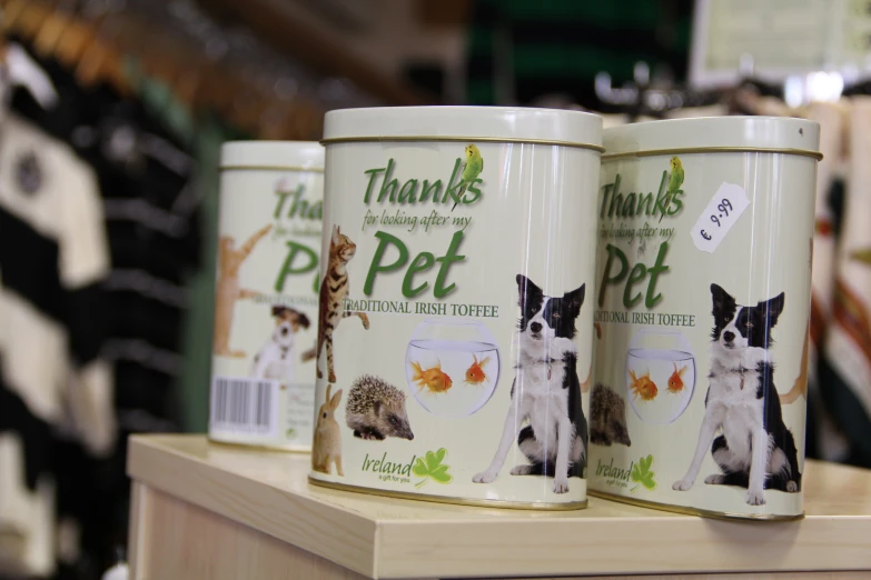 a close up of two cans of pet food