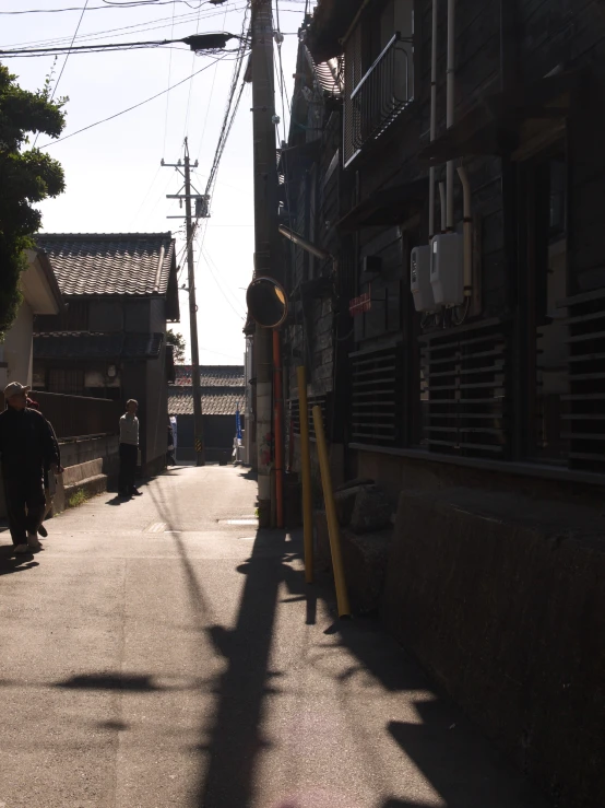 people walk on the street in an oriental town