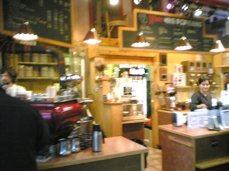 an coffee shop is decorated in wood and green colors