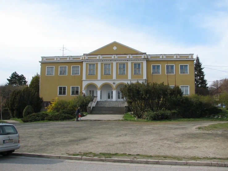 a house with a large lawn in front of it