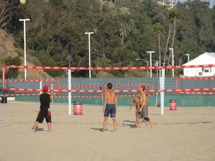 boys playing with a beach volley ball on the beach
