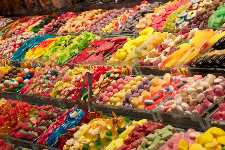 an assortment of different types of candy in boxes