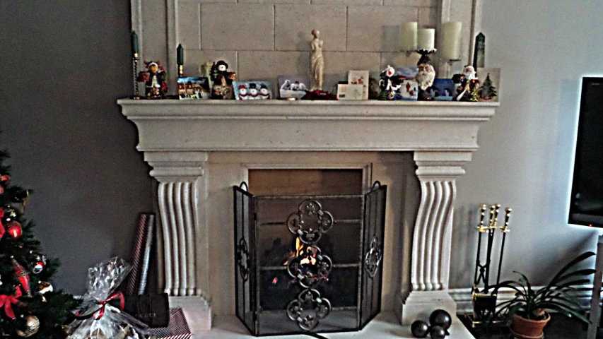 christmas decorations are scattered throughout the fireplace