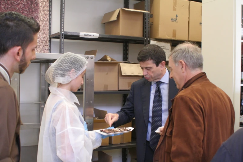 a man giving soing to a woman in scrubs and a veil