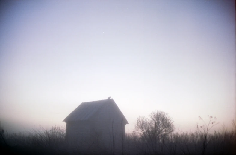 there is an image of a barn in the countryside