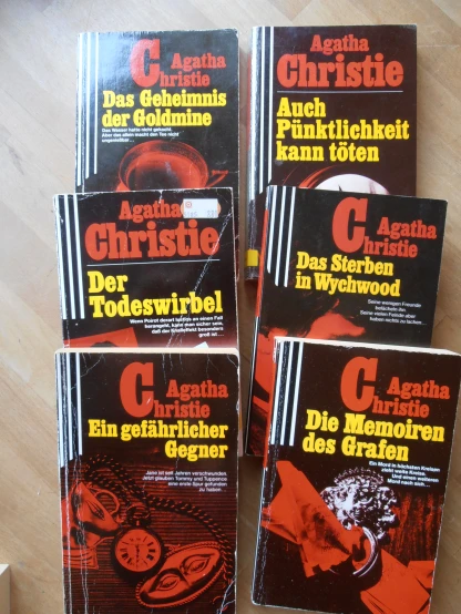 six german books are placed side by side