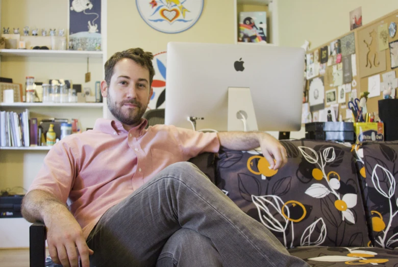 a man sitting on top of a couch