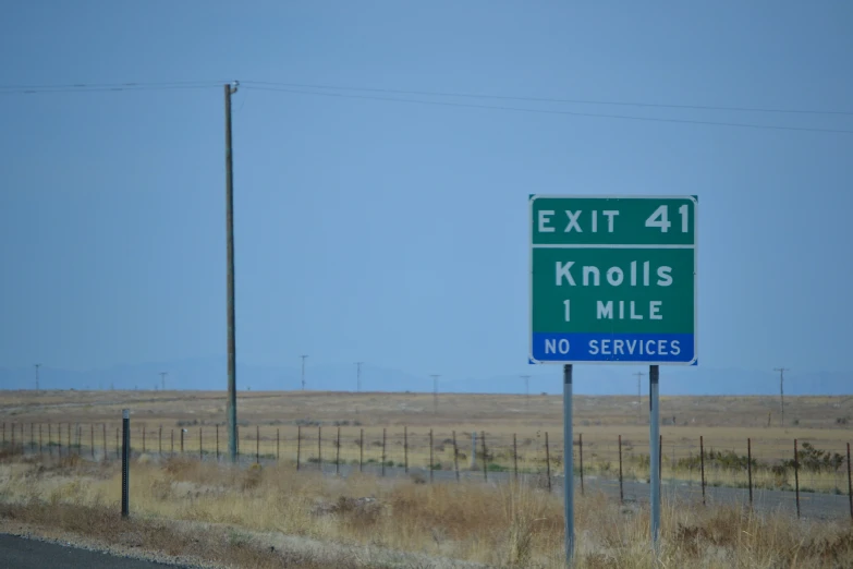 exit 4 and kholis 1 mile signs with no services