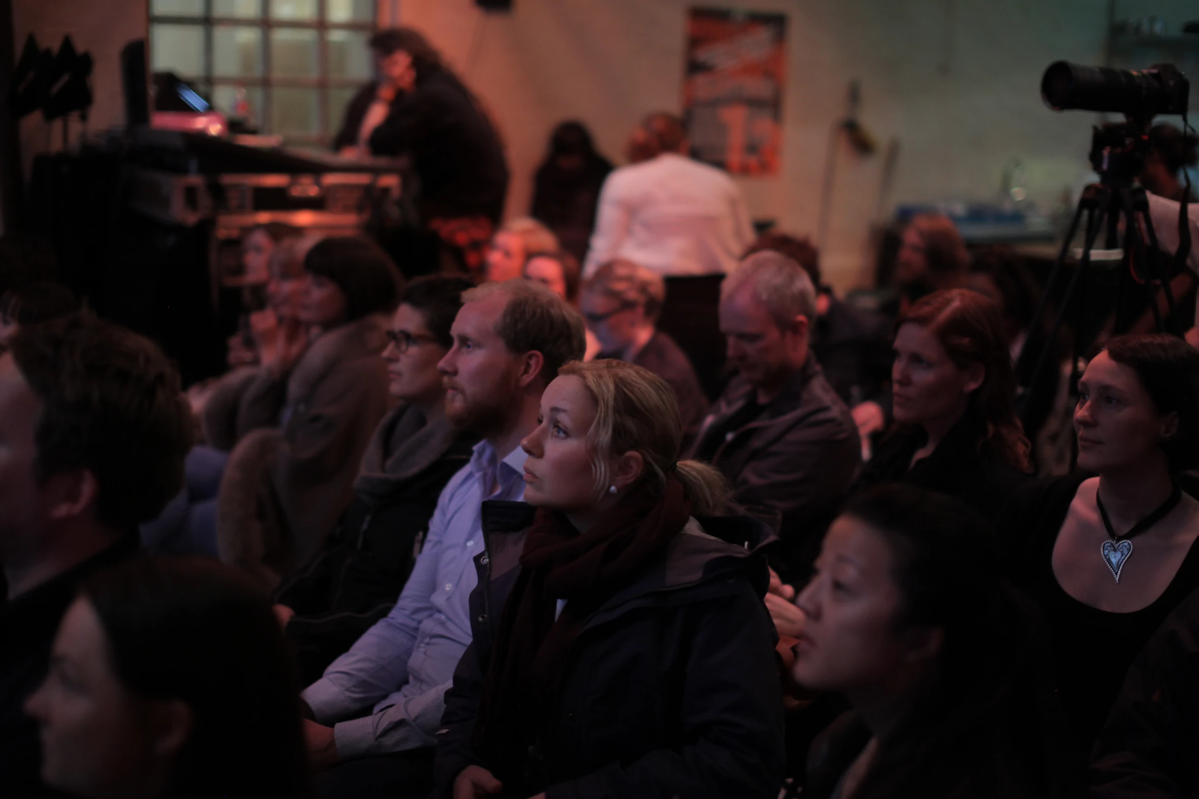 a large group of people at a public meeting