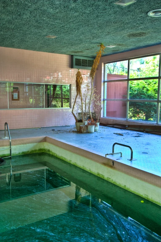 a pool that has a ladder inside of it