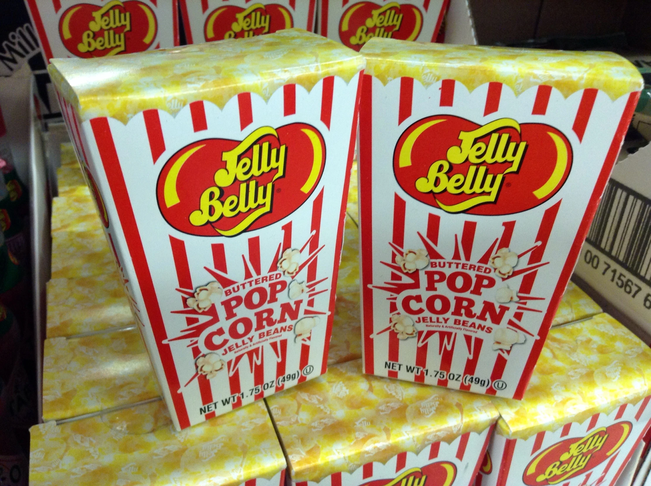 small red popcorn boxes on display in a store