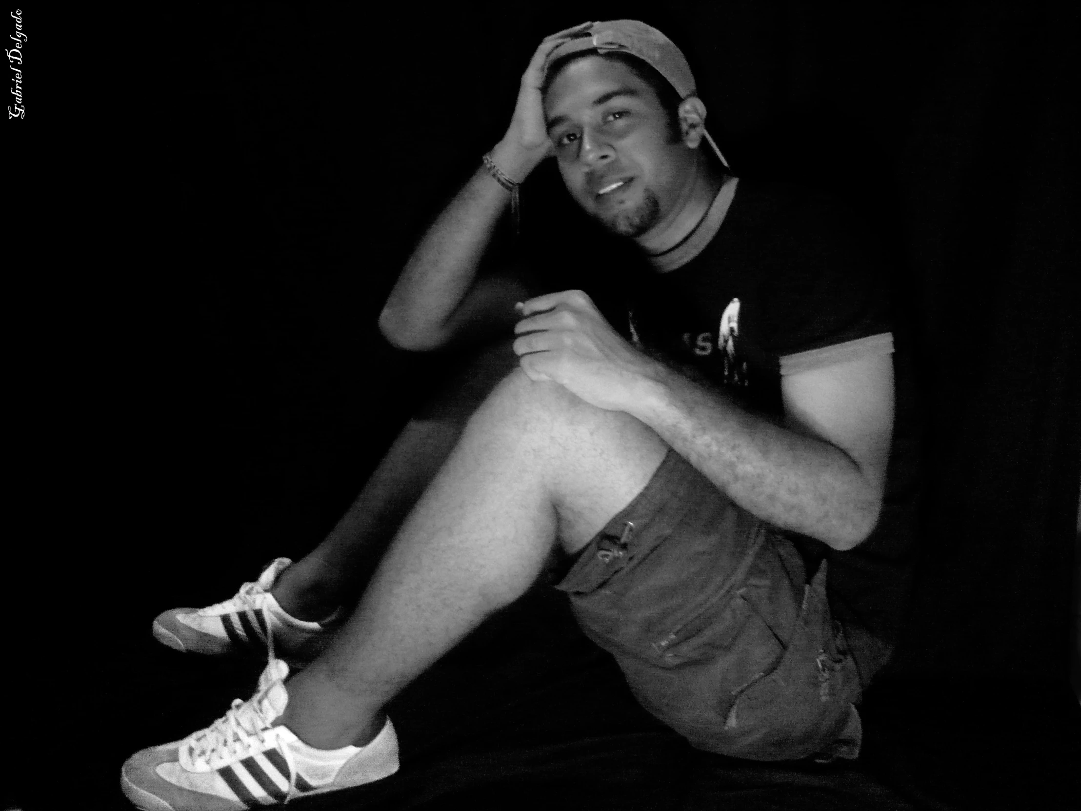 a black and white image of a man in shorts