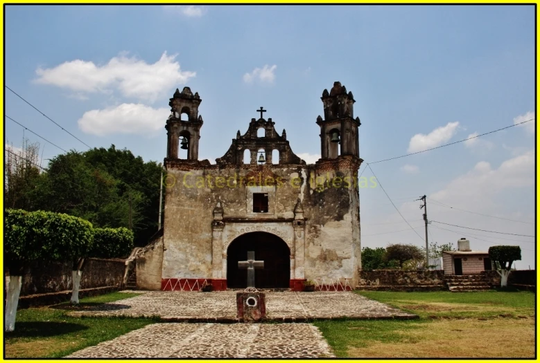 an old stone church with two towers on the front