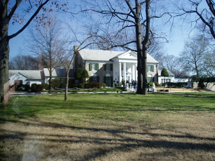 large white home in middle of empty lot