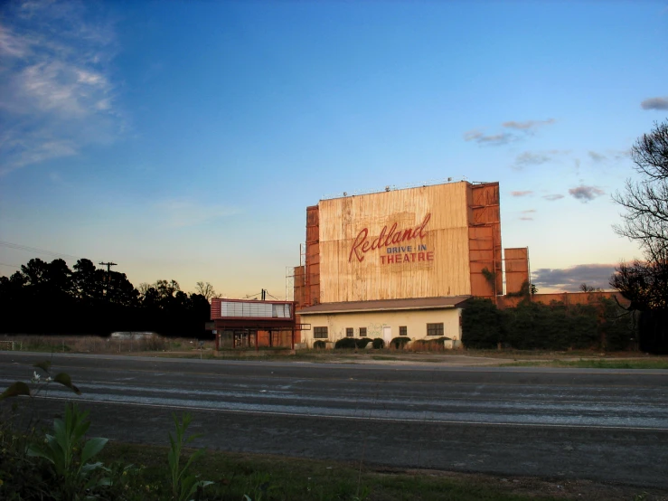 a large building sitting on the side of a road