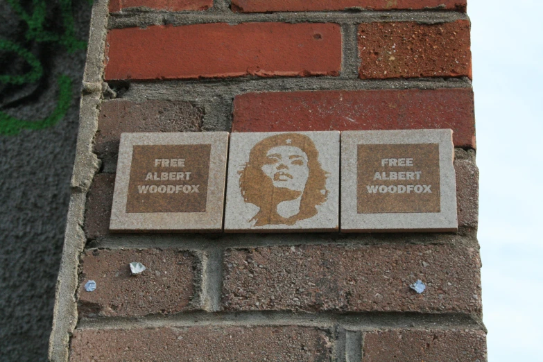 two stencils on the wall that show images of elvis presley