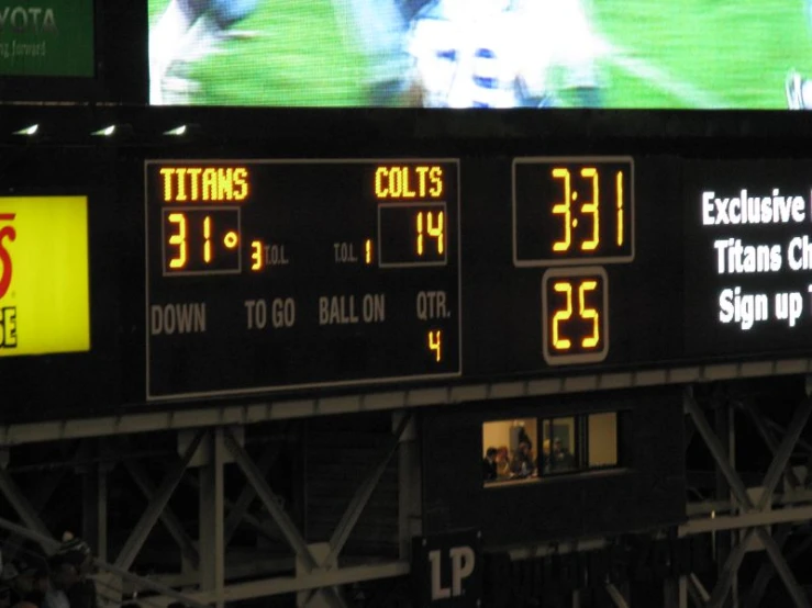 the scoreboard shows the football game time