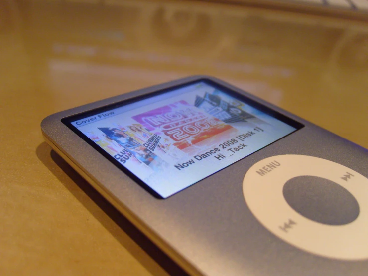 an ipod with music playing on the display