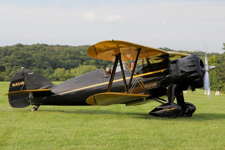 a small plane on a field of grass