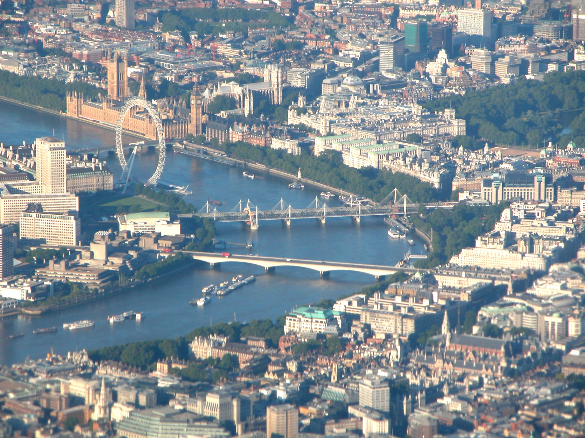 an aerial view of london's river thames, including the shardler bridge