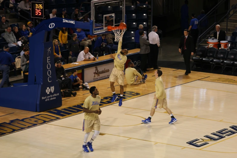 the boys are playing basketball on the court