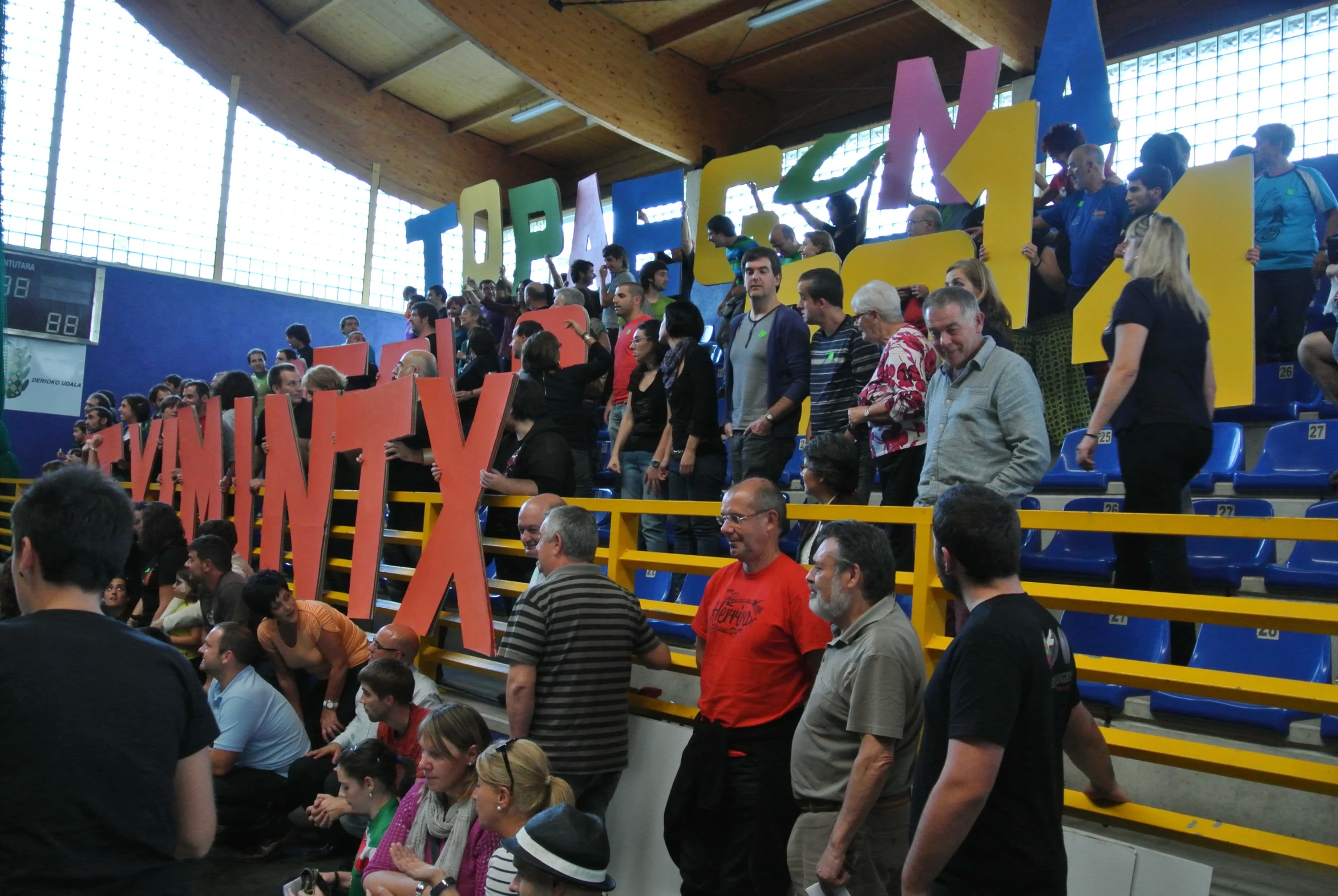 several people standing on the stairs of the stadium