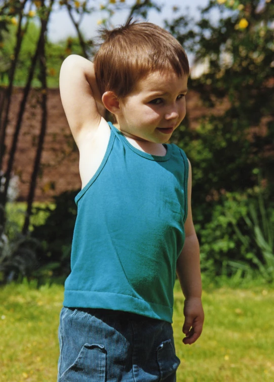 a little boy that has a frisbee in his hand