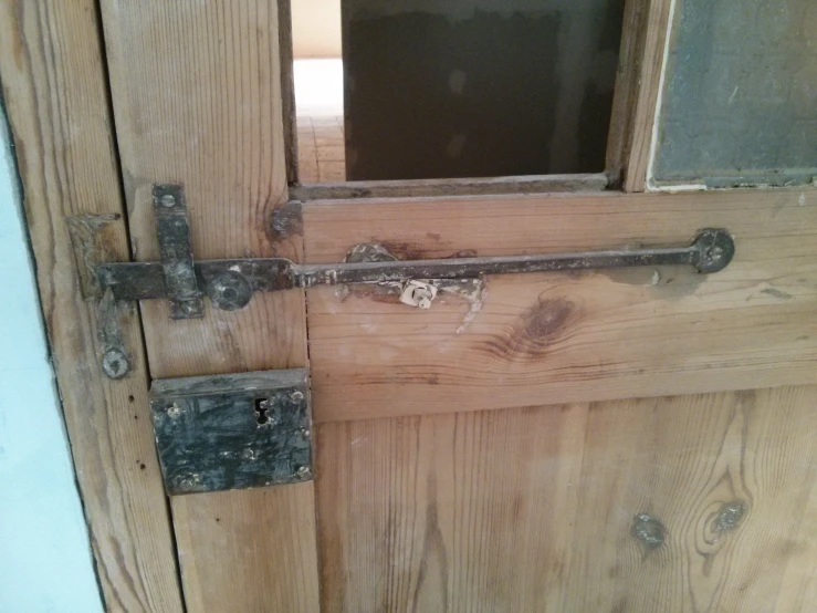 two old metal doors that have been locked with s