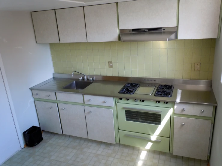 a kitchen that has been cleaned with an oven