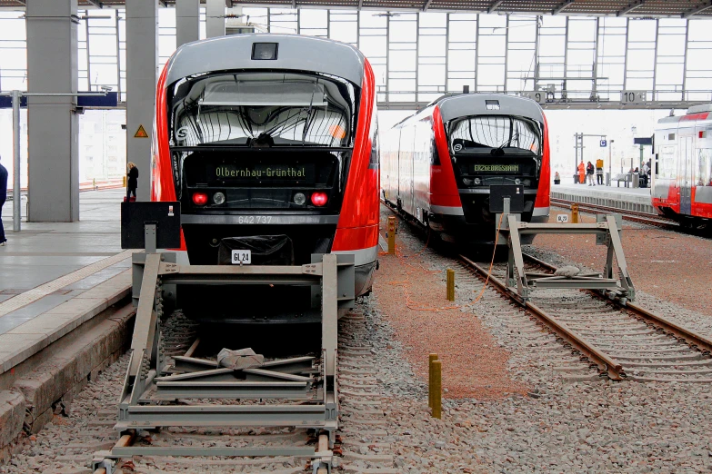 two trains that are on the train tracks