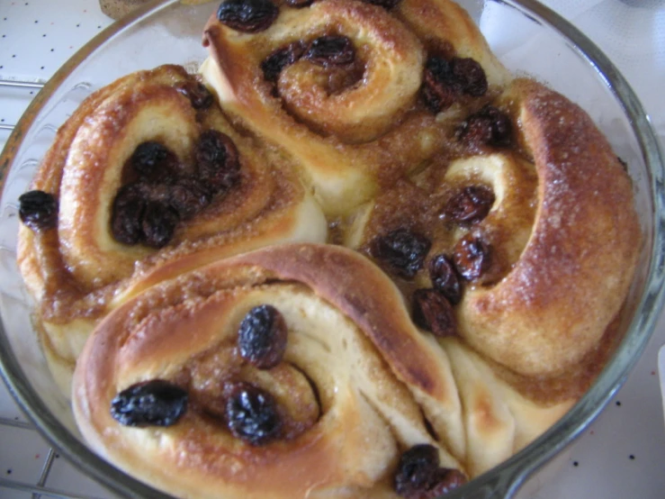 cranberry cinnamon rolls in a dish on a counter