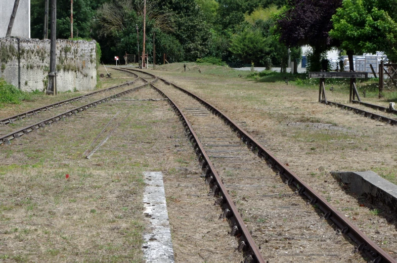 a railroad track lined with empty train tracks