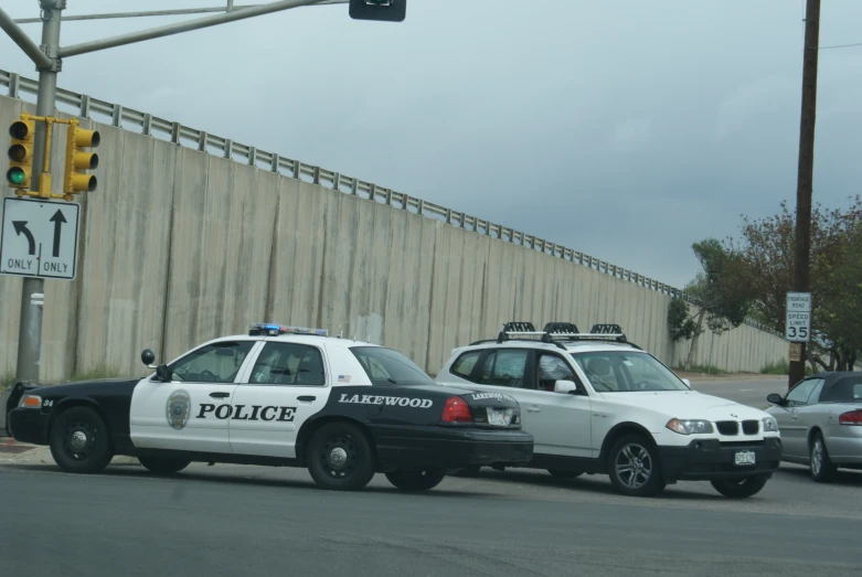 two police cars are parked next to each other