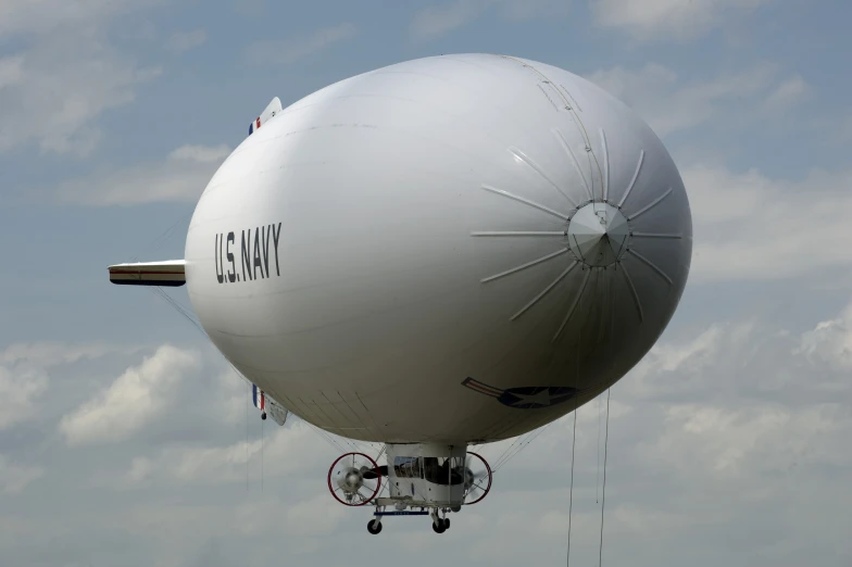 a big airplane with an attached parachute flying through the sky