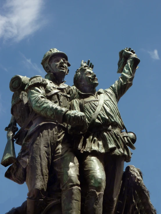 a statue of two men with arms around each other