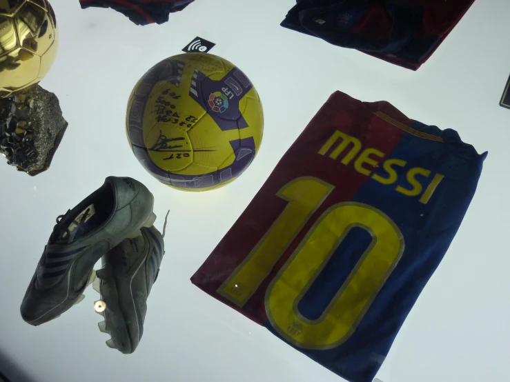 many different sports memorabilia laid out on a table